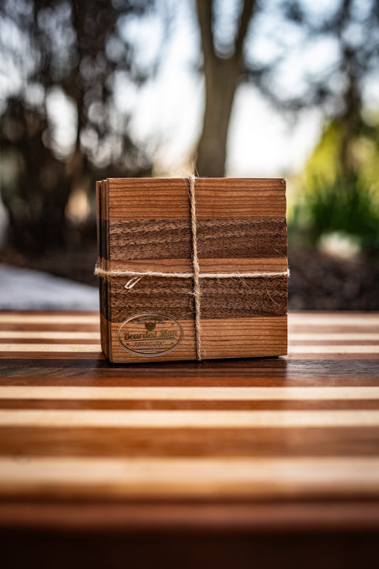 Wooden box tied with twine on a wooden surface with a blurred natural background